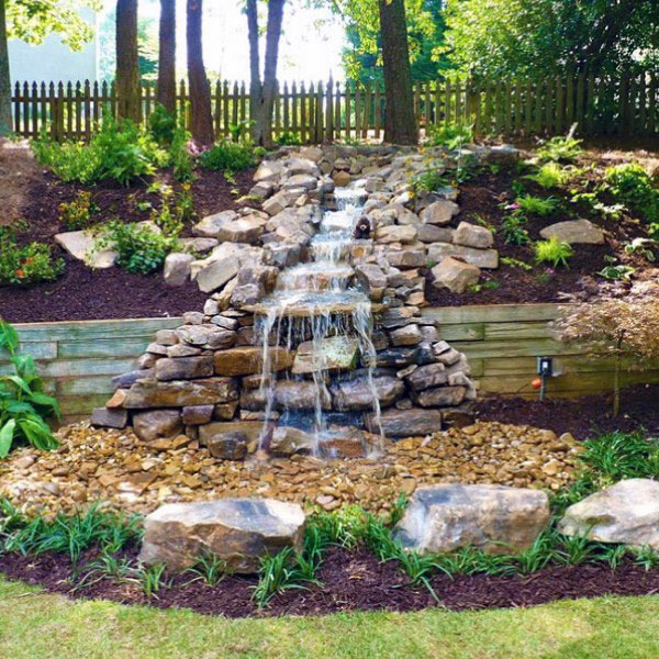 Custom landscaping and waterfall by Paccione & Sons